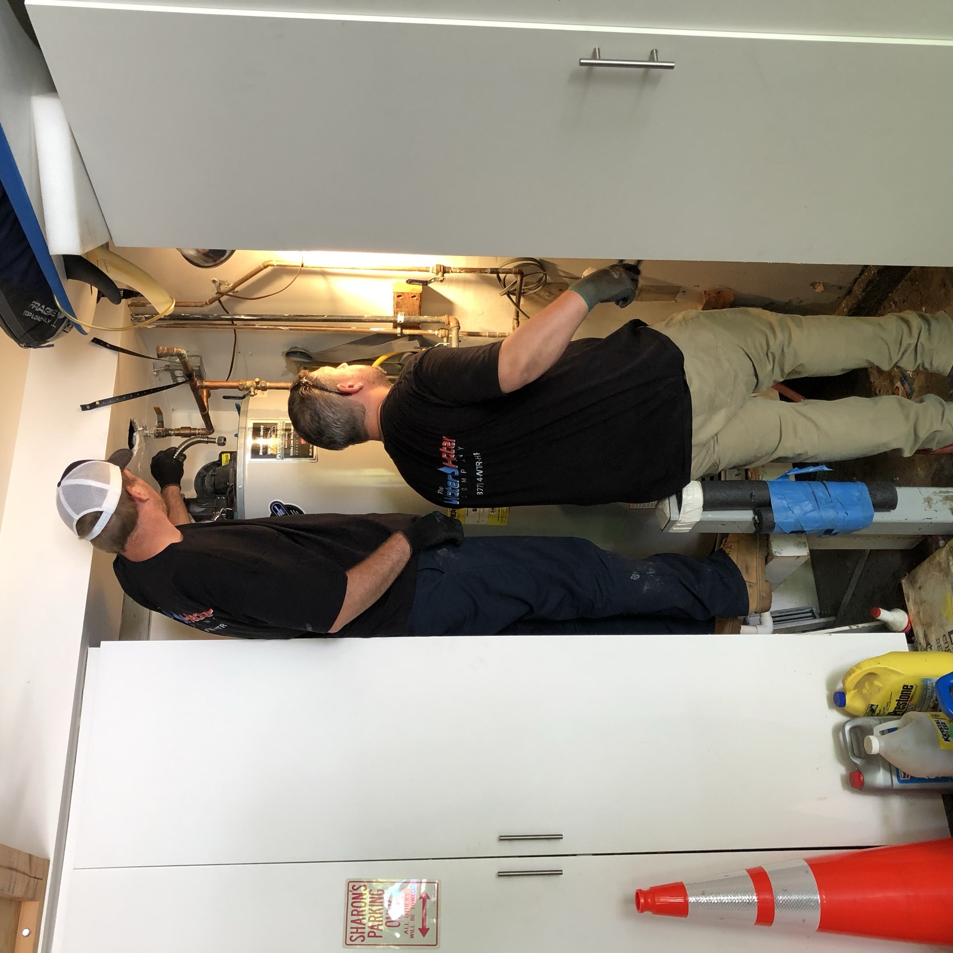 Water Heater Company specialists servicing a water heater